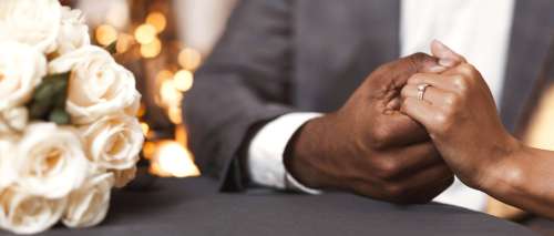 Engagement concept. Cropped image of black couple in restaurant, woman said yes on marriage proposing