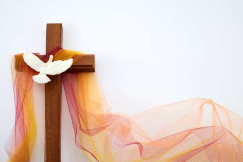 Pentecost Sunday. Pentecost background with flying dove and cross